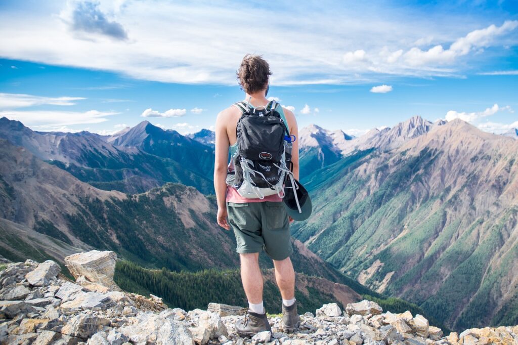 Adventure traveler overlooking mountains.