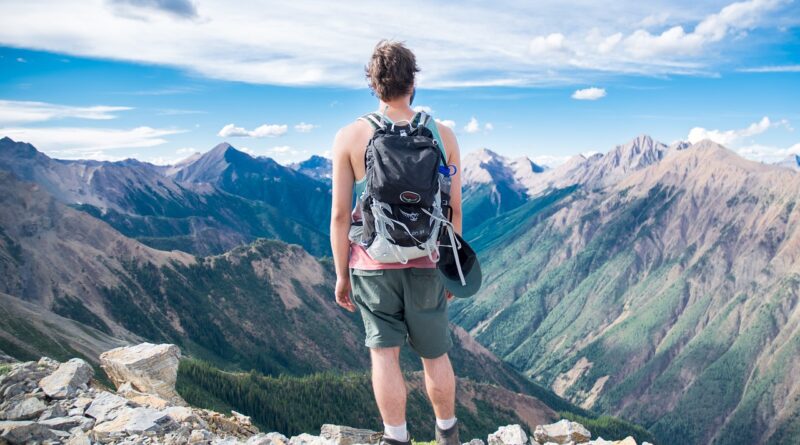 Adventure traveler overlooking mountains.