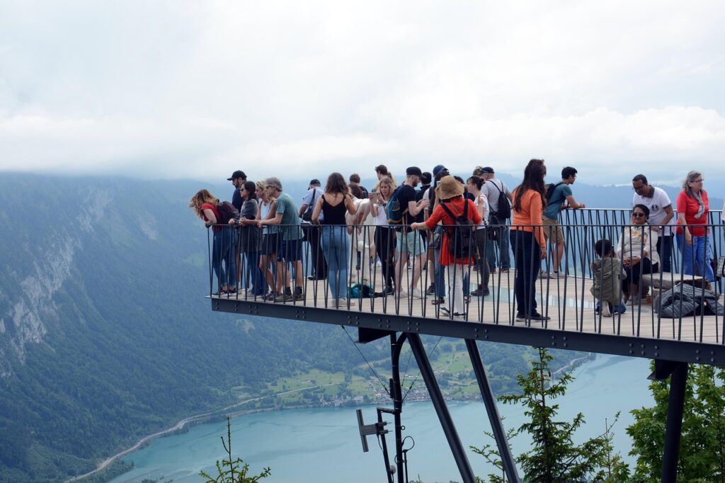 People gathered at Harder Kulm overlooking the towns Interlaken and Unterseen