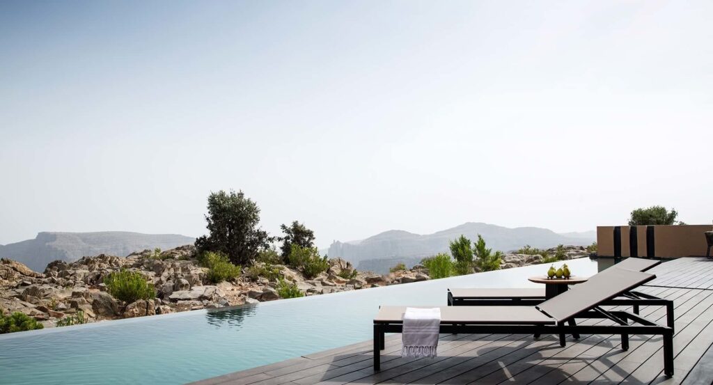An infinity pool overlooking the nature landscape of Oman