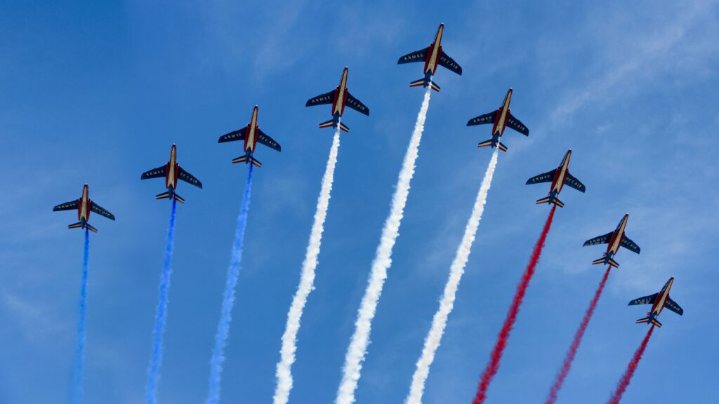 The Alpha Jets stream the colours of the French flag above the Champs-Elysées during the annual July 14th military parade in Paris.