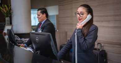 Female hotel receptionist on the phone