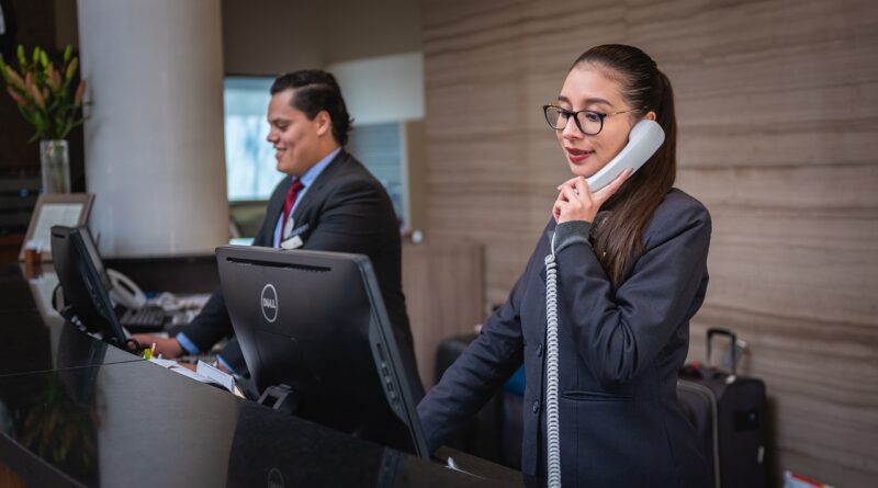 Female hotel receptionist on the phone