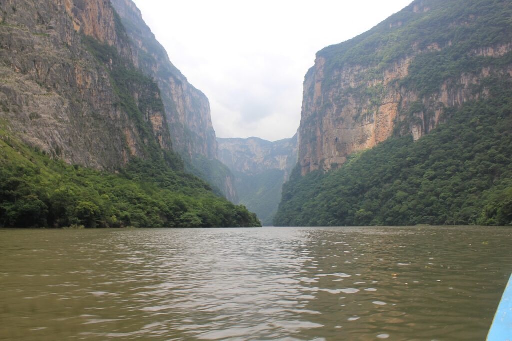 Towering canyon walls along river inside Sumidero Canyon, Mexico hidden gem