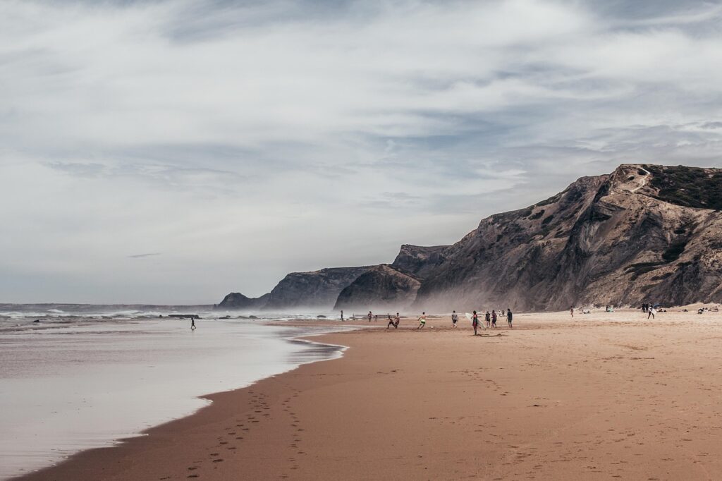 A beach in the Algarve region in Portugal surrounded by rock formations