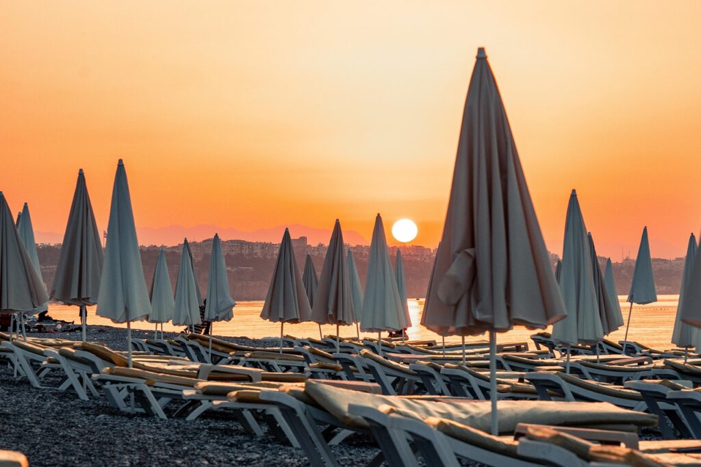 Parasols on the beach during sunset