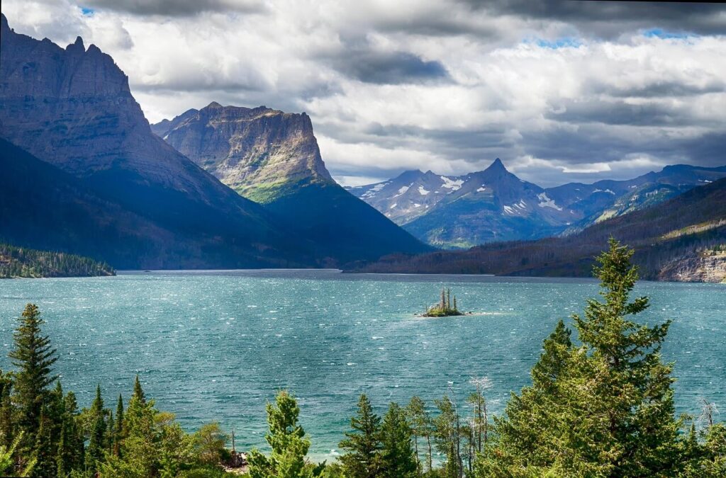 Turquoise alpine lake in Glacier National Park with mountain backdrop, Hidden Lake Trail