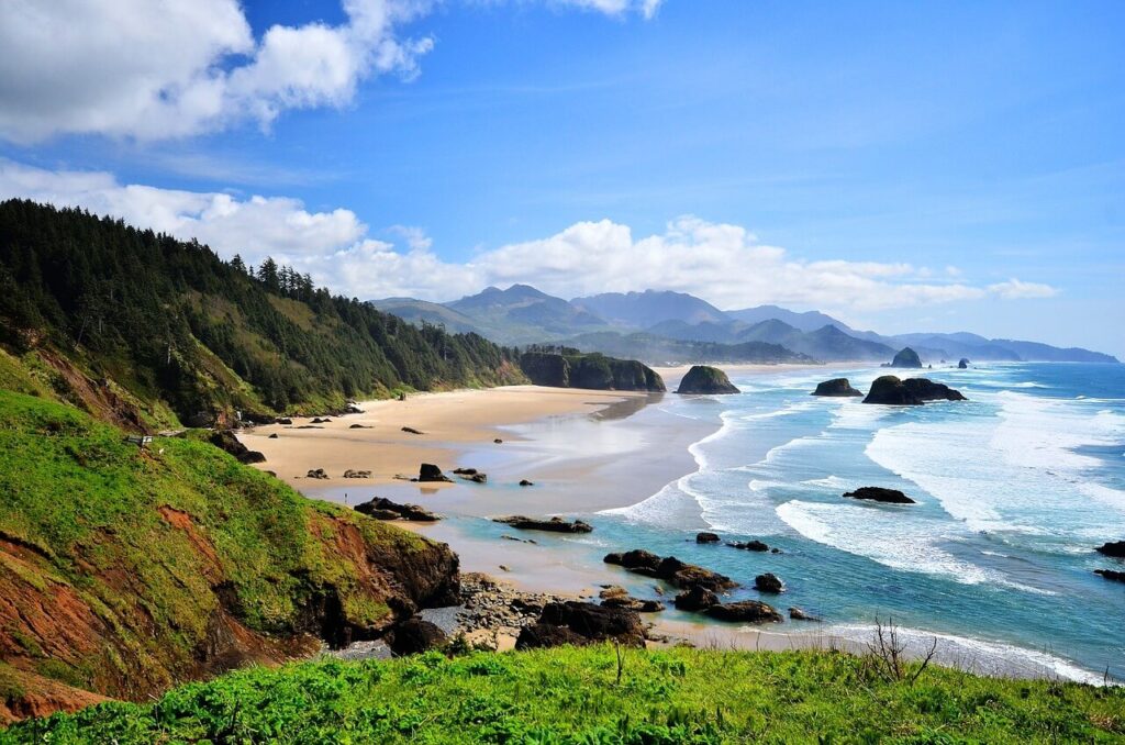 Secluded Oregon coastline with cliffs and hidden beach cove