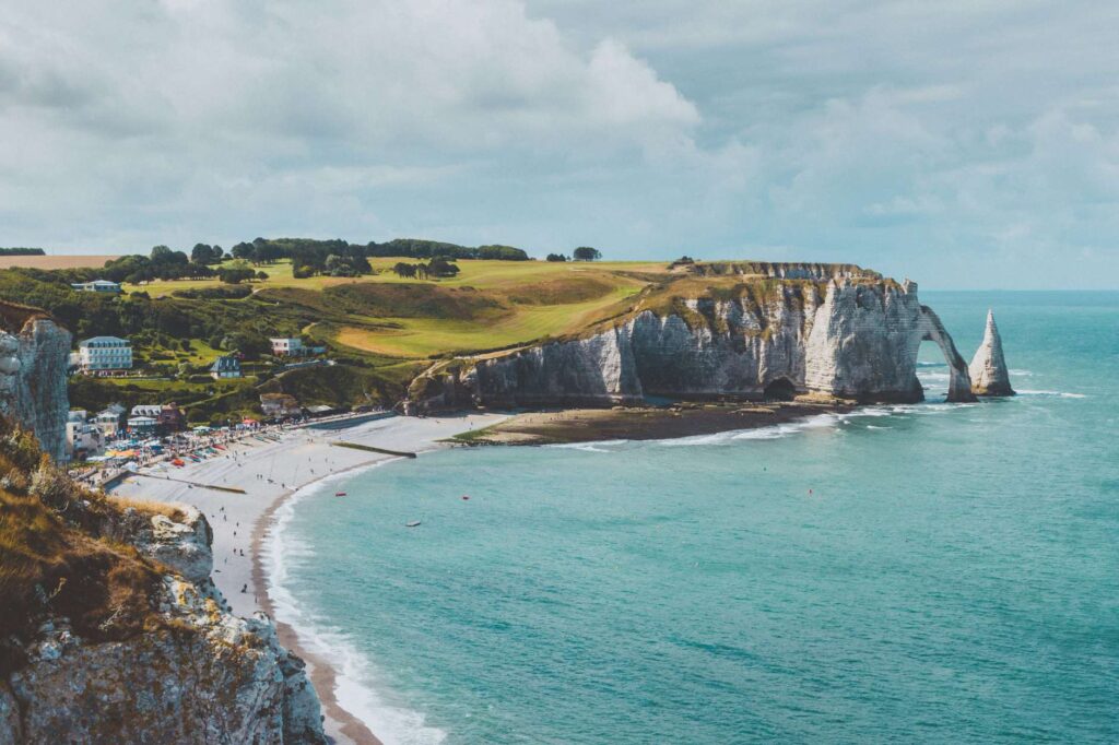 Beach in Normandy, France. Crystal clear water and dramatic cliffs.
