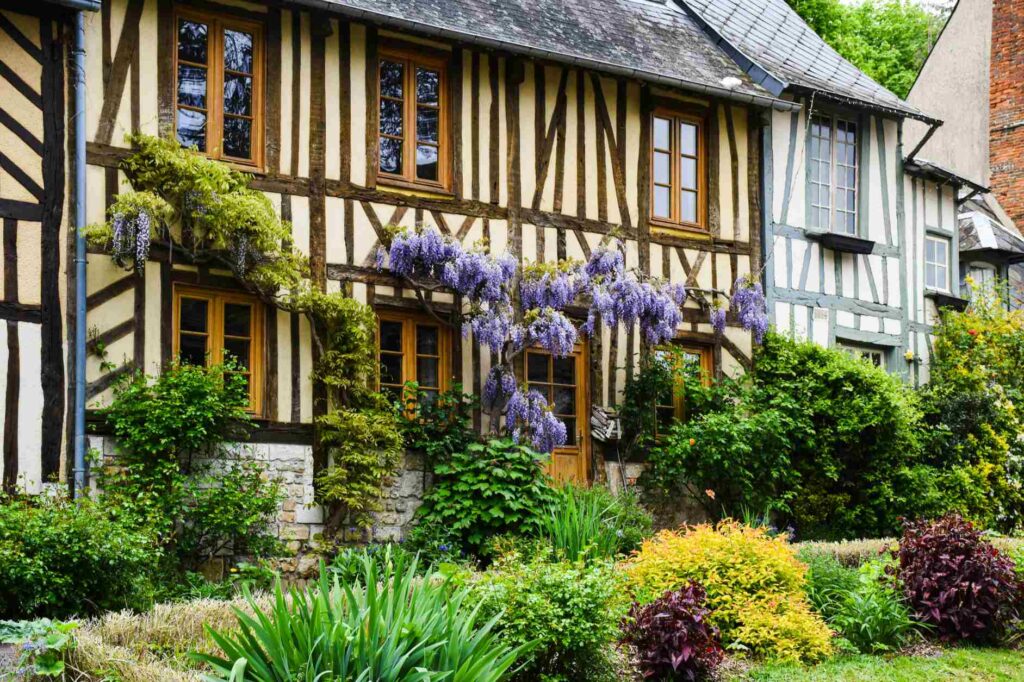 Medieval house in Giverny with greenery around it