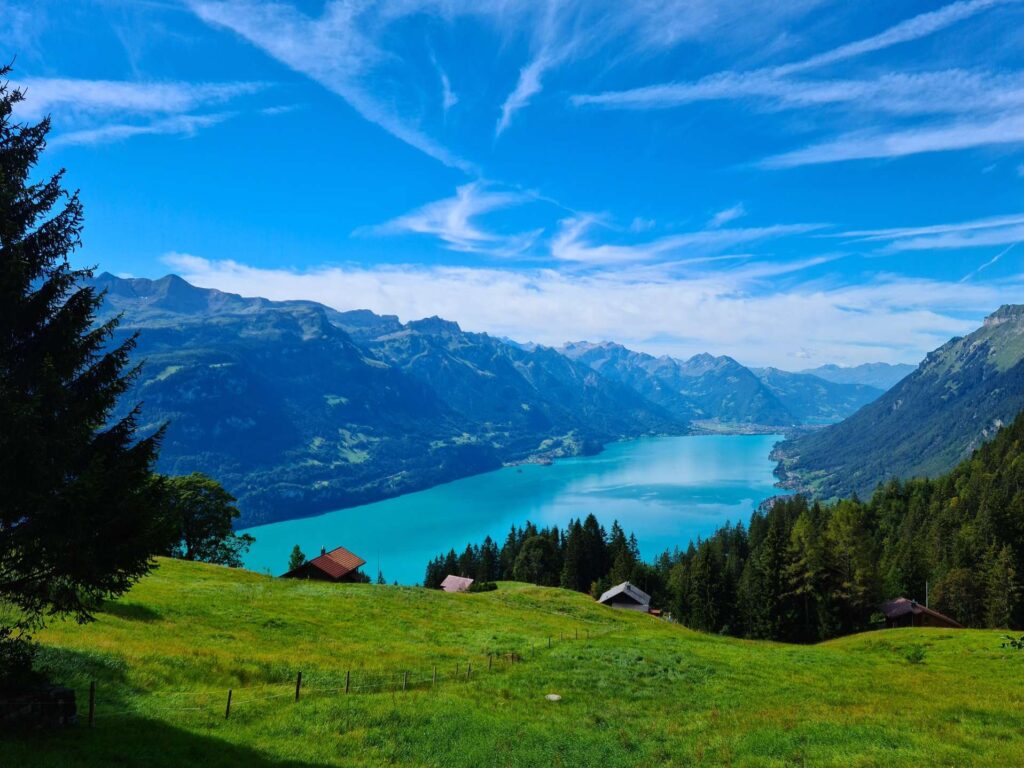 View of the river surrounded by green mountains in Interlaken