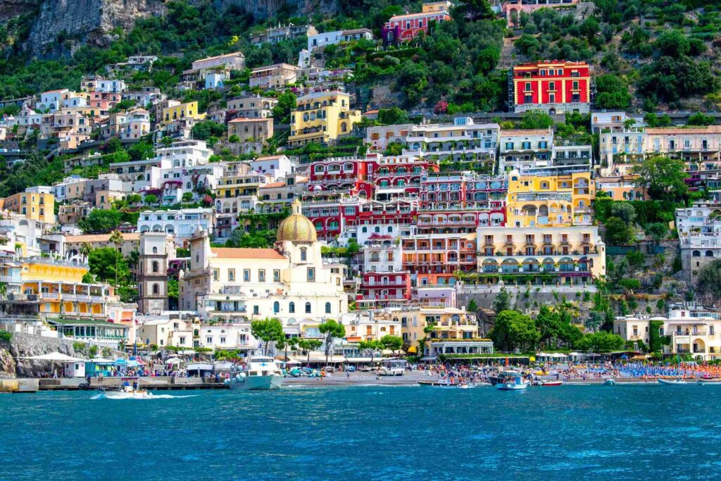 Colorful houses above the sea in Positano, one of the best places to visit in Italy for the first time
