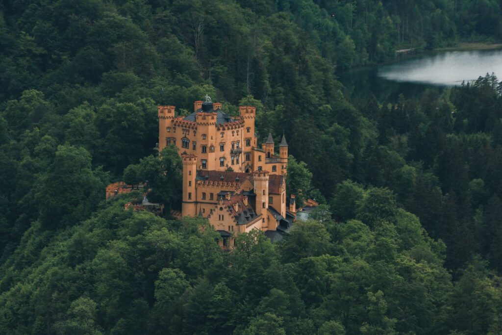 Yellow Hohenschwangau Castle above Lake Alpsee in Bavaria