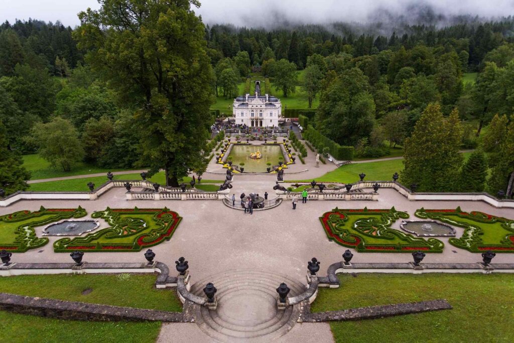 Linderhof Palace and its fountain in the Graswang Valley, Bavaria